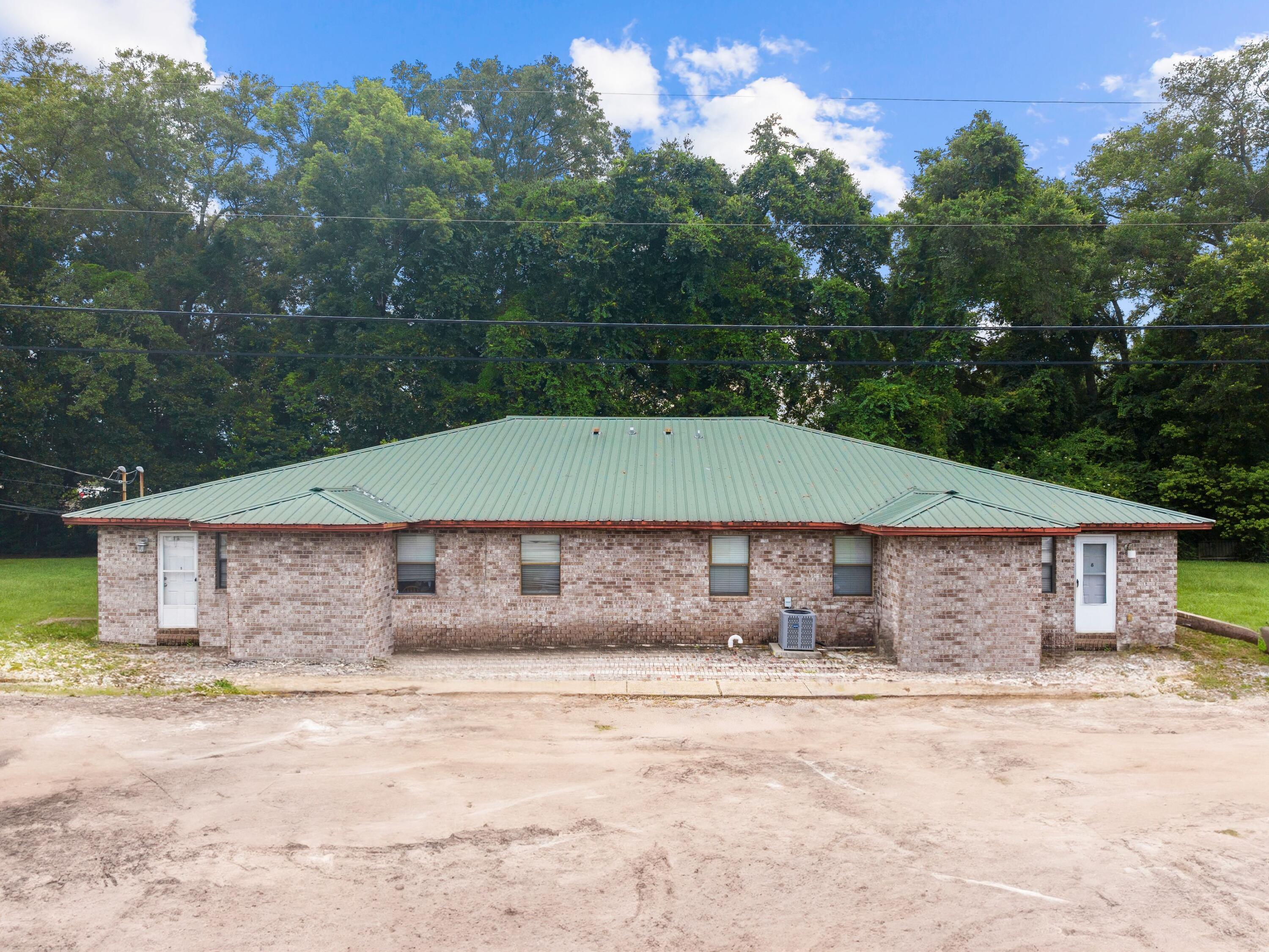 130 East 9 Mile Road, Unit 58 Pensacola, FL 32534 - Photo 7 of 50 a small pool with a outdoor seating