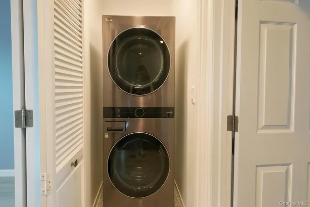 a close view of a utility room with dryer and washer