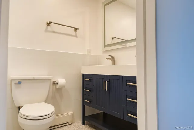 a bathroom with a toilet and a sink