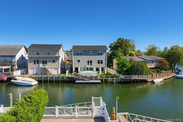 a view of houses with outdoor space and lake view