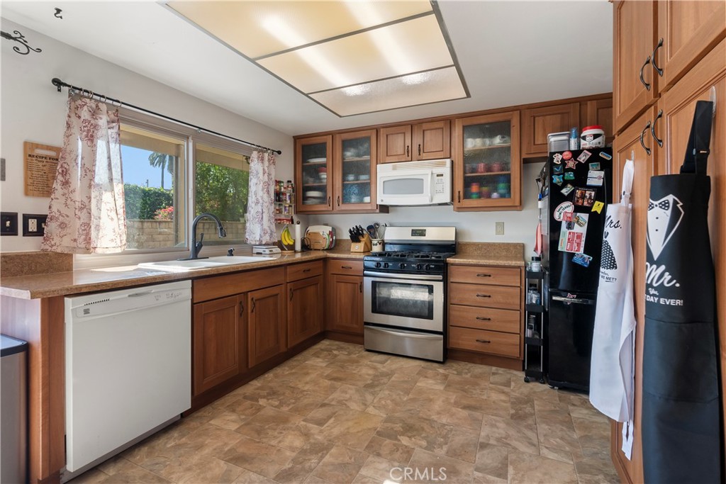 6624 Banyan Place Riverside, CA 92506 - Photo 15 of 41 Remodeled kitchen: custom cabinetry, solid surface countertops, large window overlooking the backyard