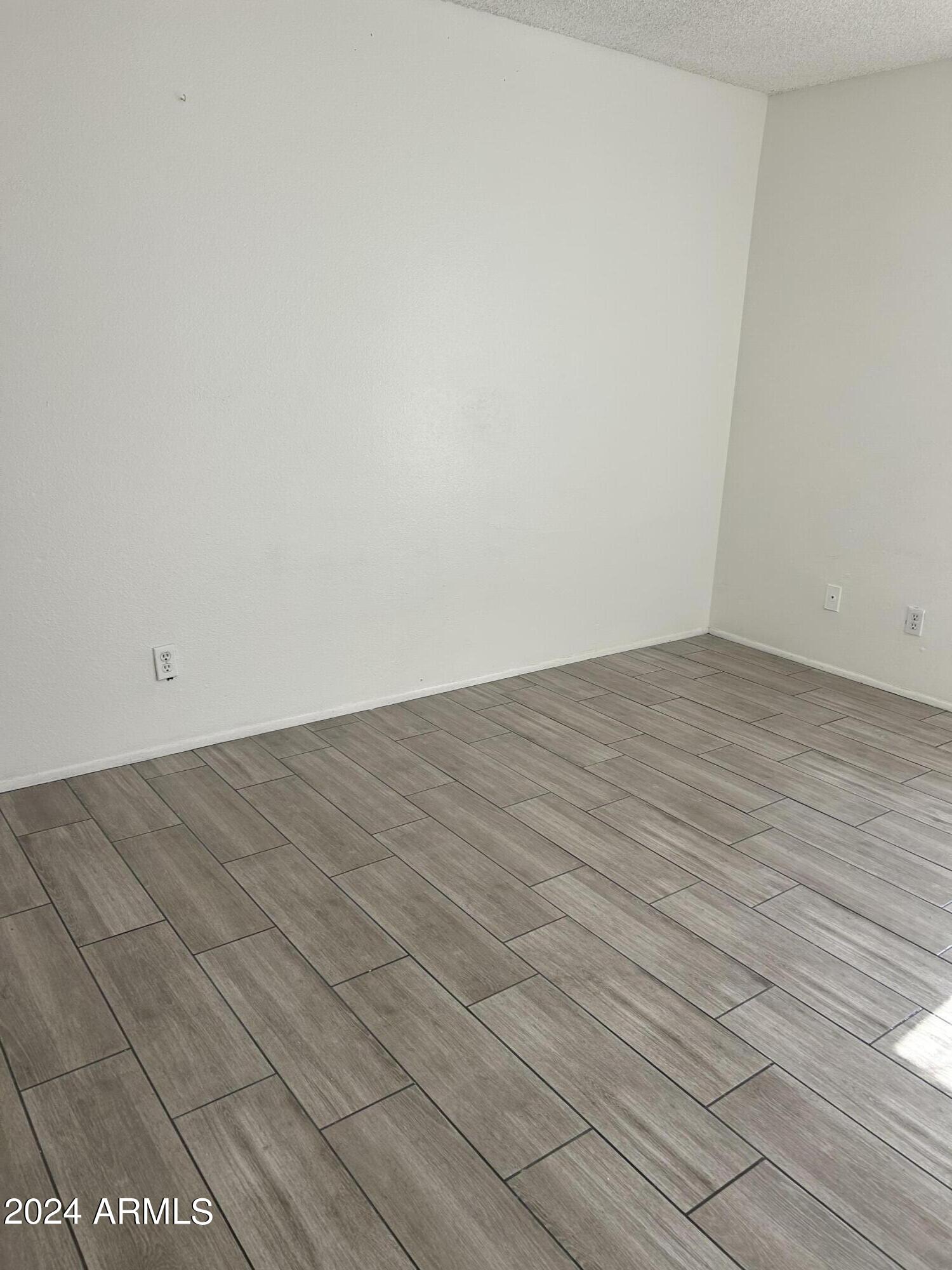 8233 North 34th Drive Phoenix, AZ 85051 - Photo 7 of 11 wooden floor in a room