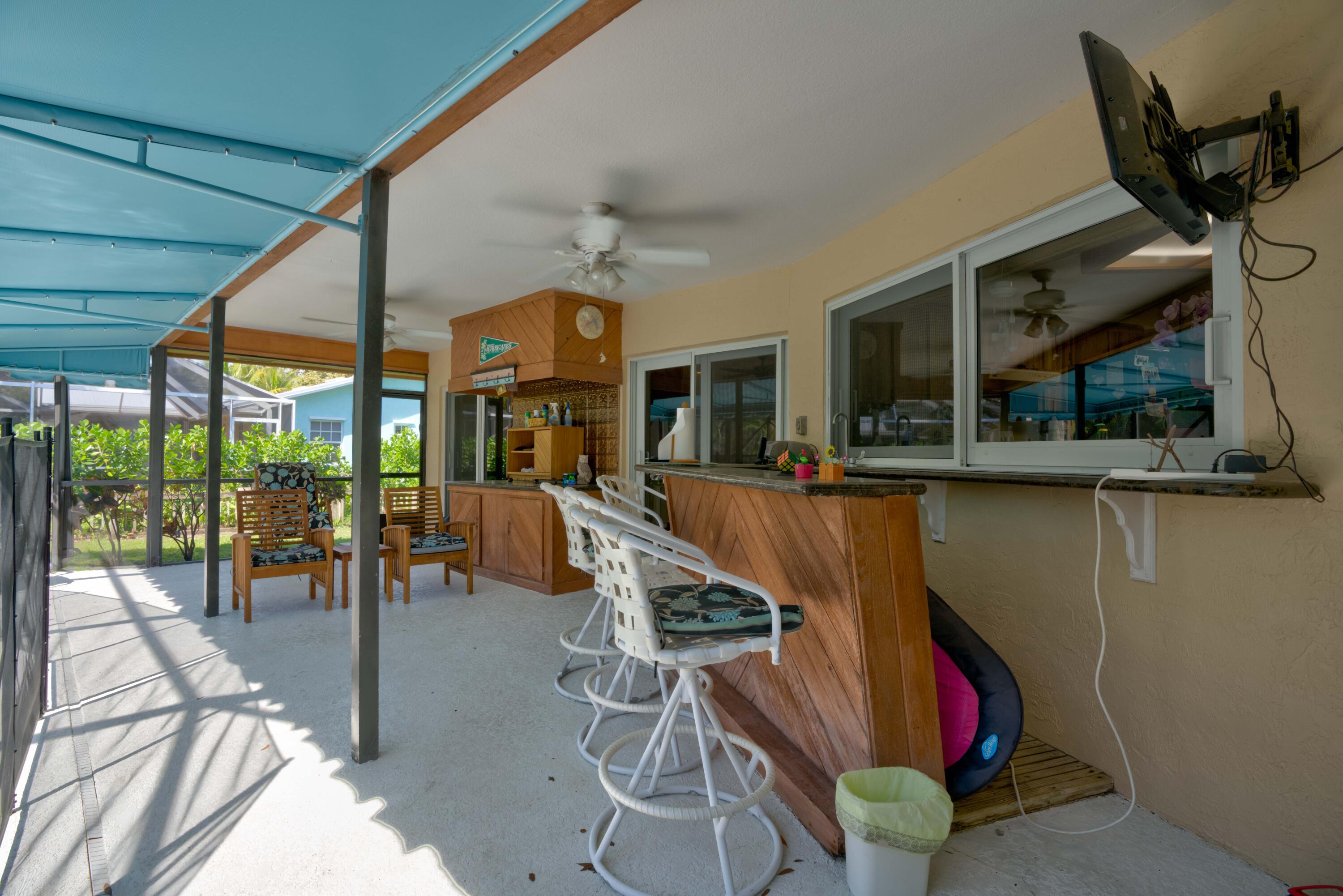 9524 Southeast Cove Point Street Jupiter, FL 33469 - Photo 9 of 58 Covered patio