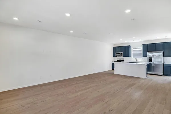 a view of a kitchen with microwave and cabinets