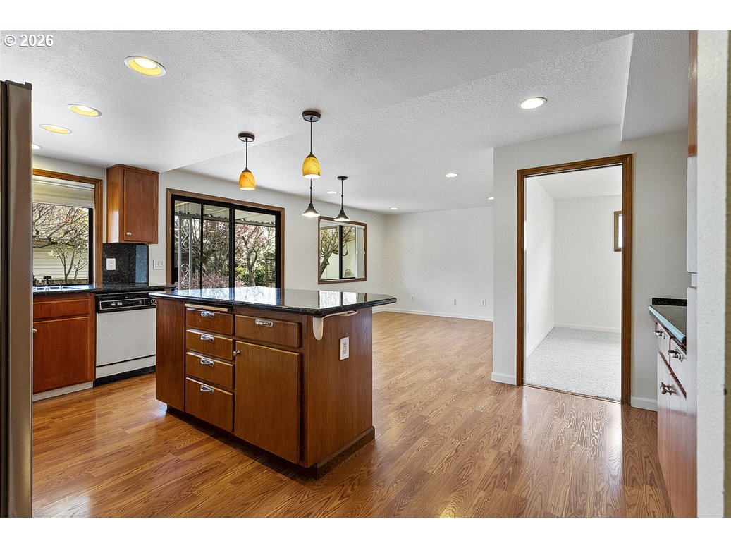 15638 Northeast Russell Place Portland, OR 97230 - Photo 20 of 46 a kitchen with stainless steel appliances granite countertop a refrigerator and a stove top oven