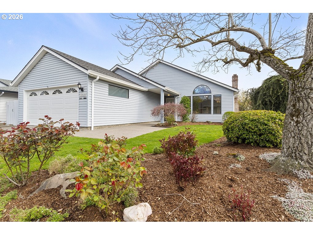 15638 Northeast Russell Place Portland, OR 97230 - Photo 2 of 46 a front view of a house with garden