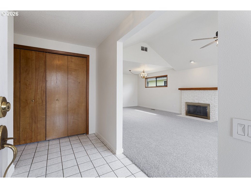 15638 Northeast Russell Place Portland, OR 97230 - Photo 3 of 46 a view of an empty room with window and fire place
