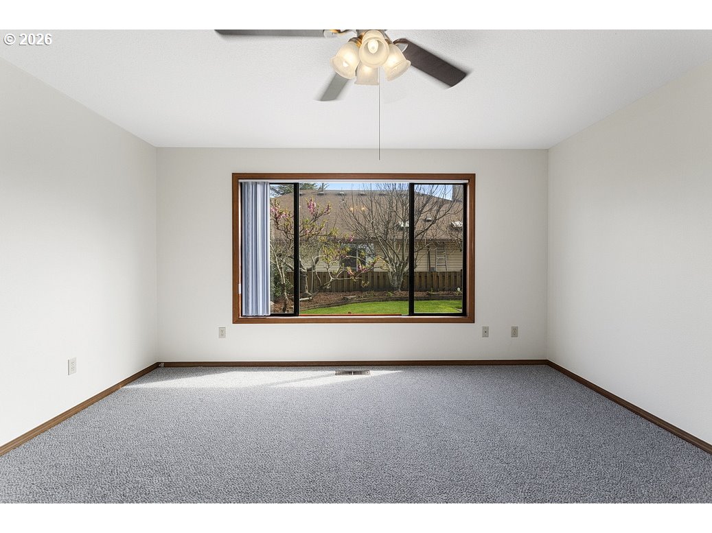 15638 Northeast Russell Place Portland, OR 97230 - Photo 33 of 46 a view of room with window and ceiling fan