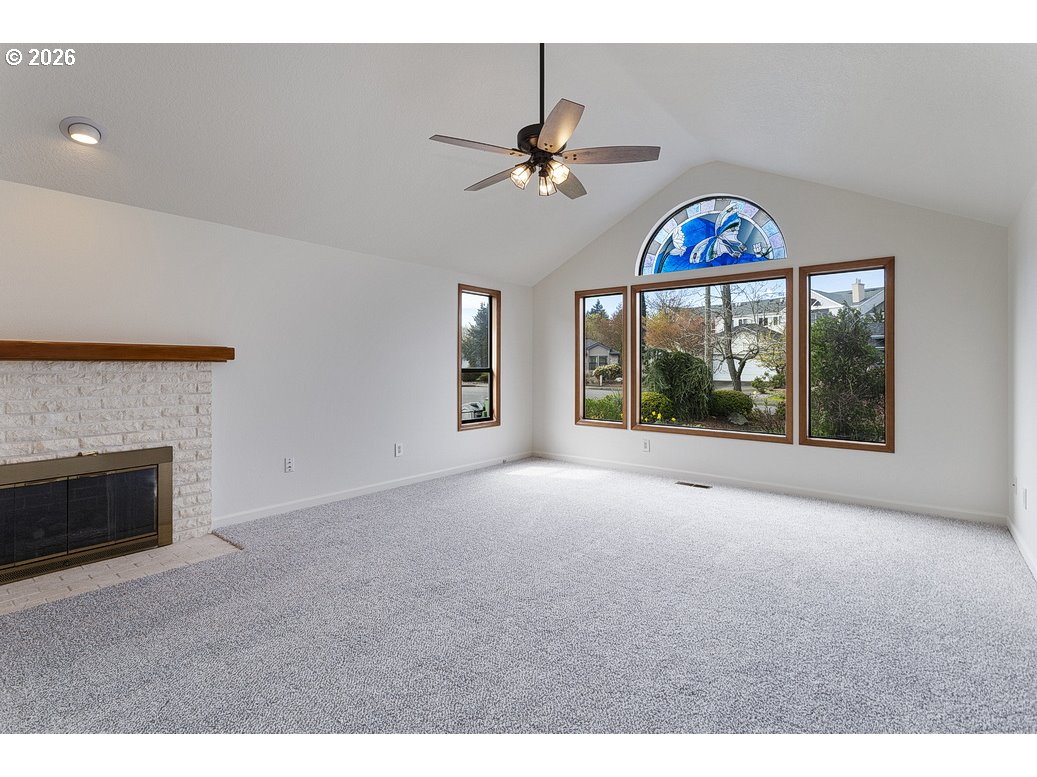 15638 Northeast Russell Place Portland, OR 97230 - Photo 6 of 46 a view of an empty room with a fireplace and a window