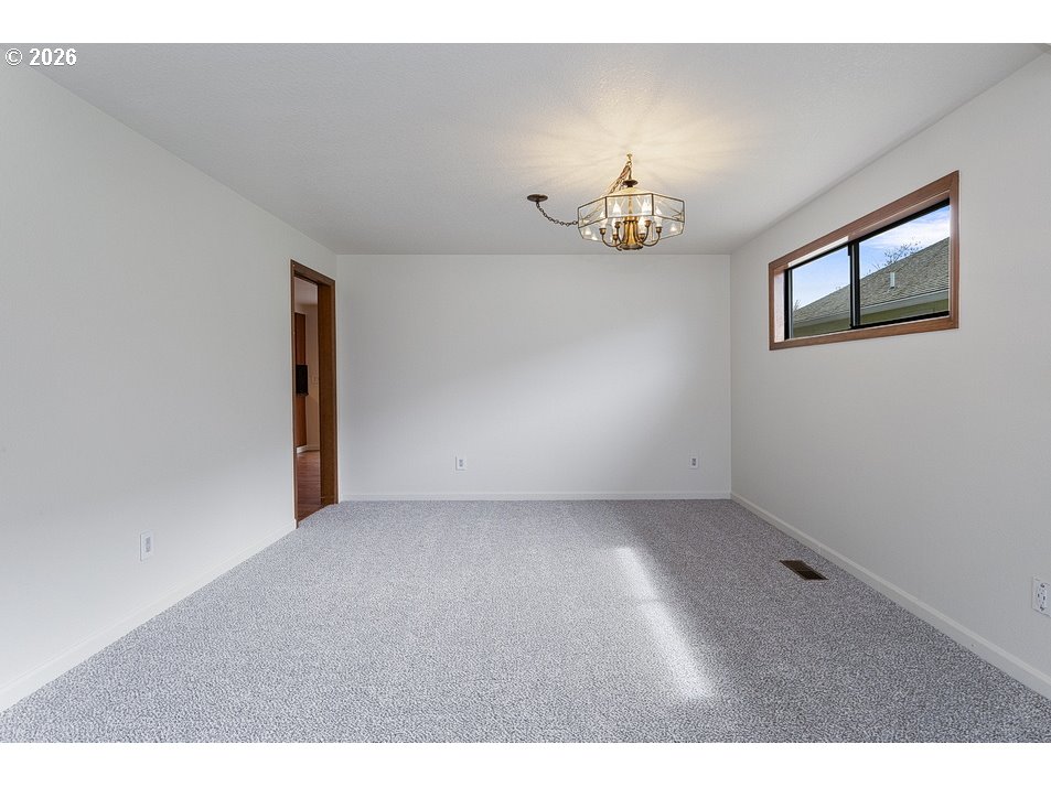 15638 Northeast Russell Place Portland, OR 97230 - Photo 9 of 46 a view of an empty room with a window