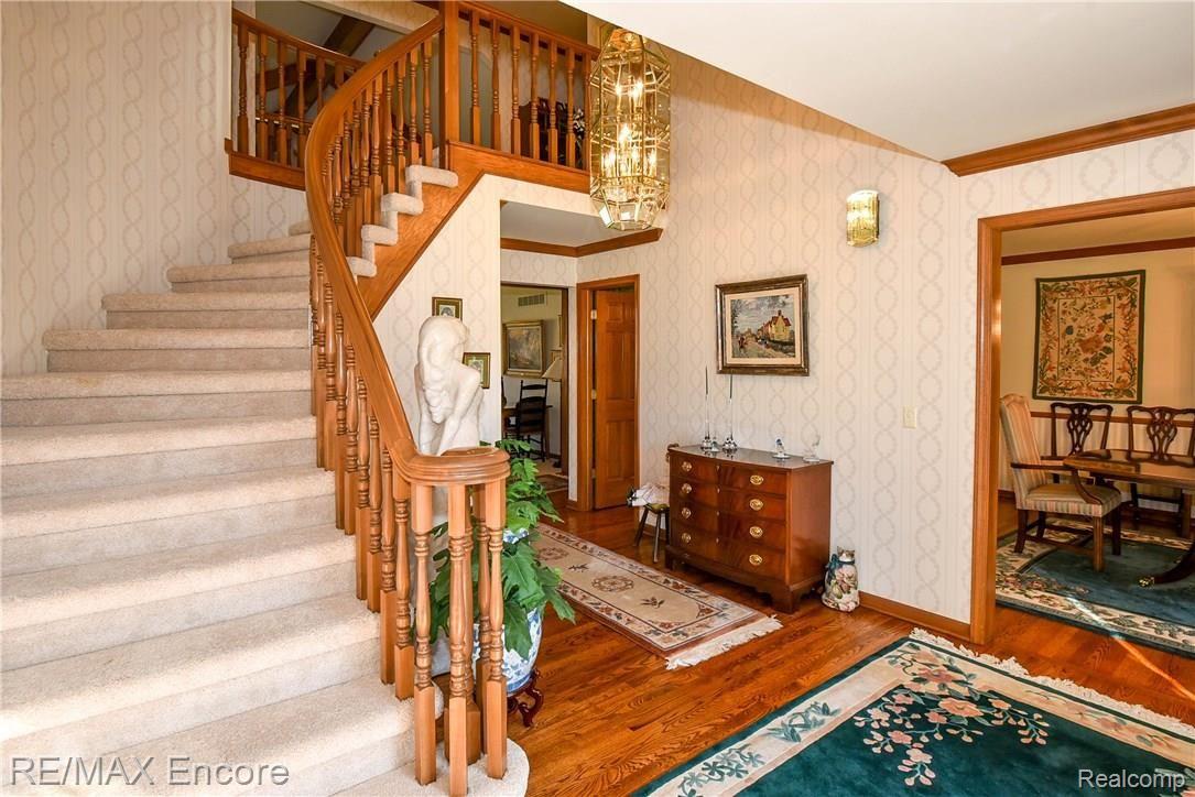 1284 Pebble Pointe Drive Rochester, MI 48307 - Photo 11 of 85 Foyer with curved staircase and formal dining room