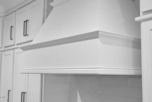 a bathroom with a double vanity sink mirror and toilet