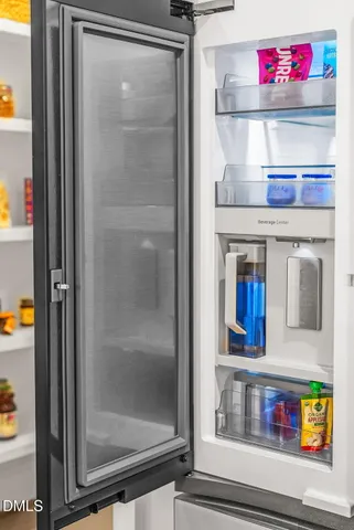a aerial view of a house next to a big yard and large trees