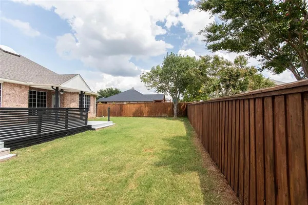 a view of a backyard with a garden