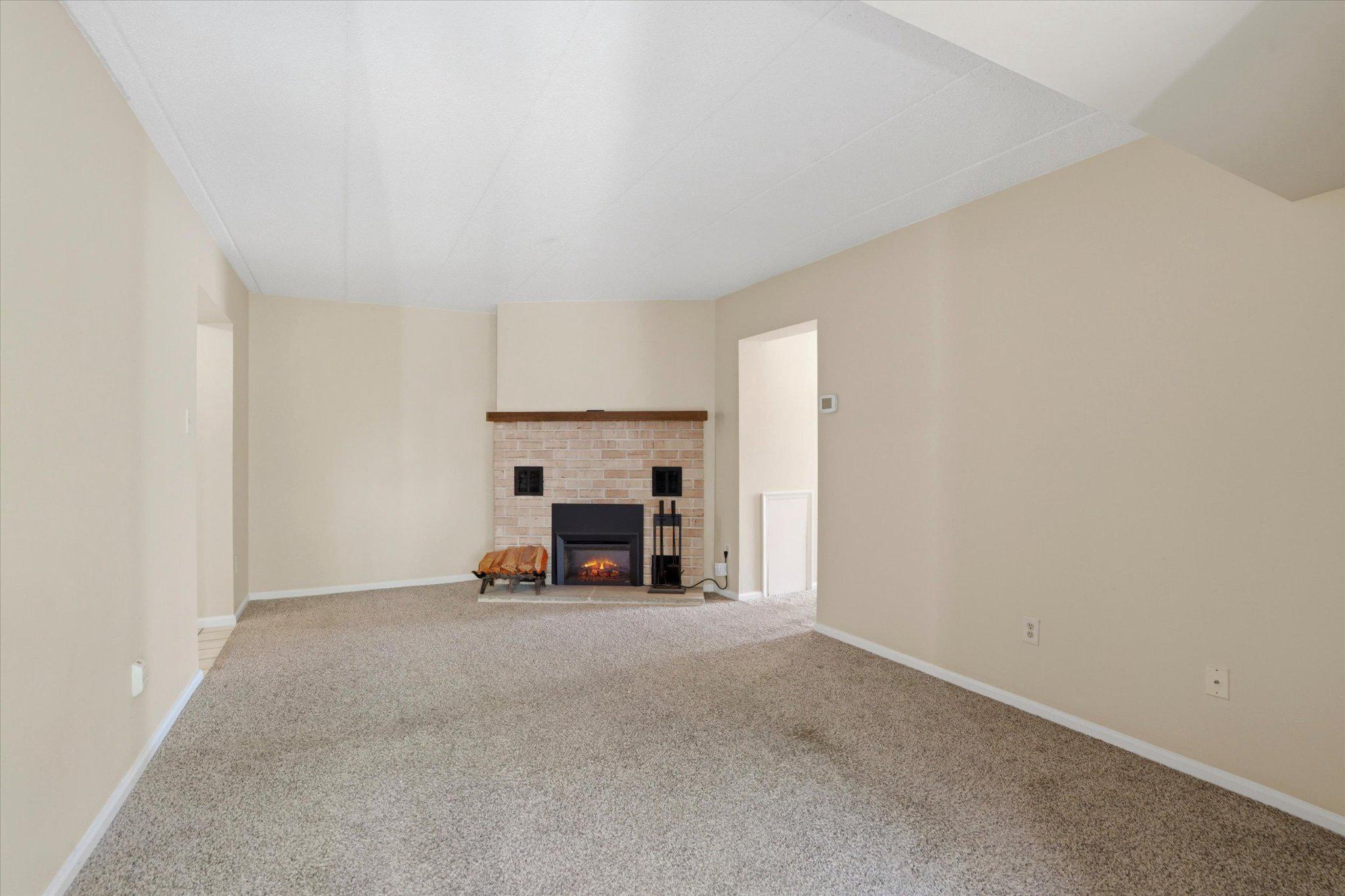623 Washington Place Chesterbrook, PA 19087 - Photo 13 of 26 a view of empty room with fireplace and window