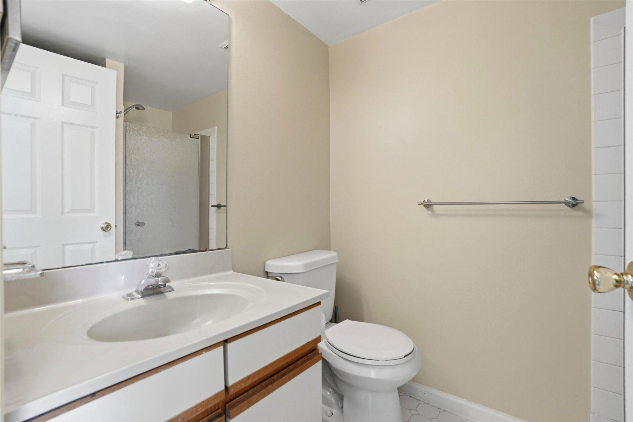 623 Washington Place Chesterbrook, PA 19087 - Photo 17 of 26 a bathroom with a sink toilet and a mirror