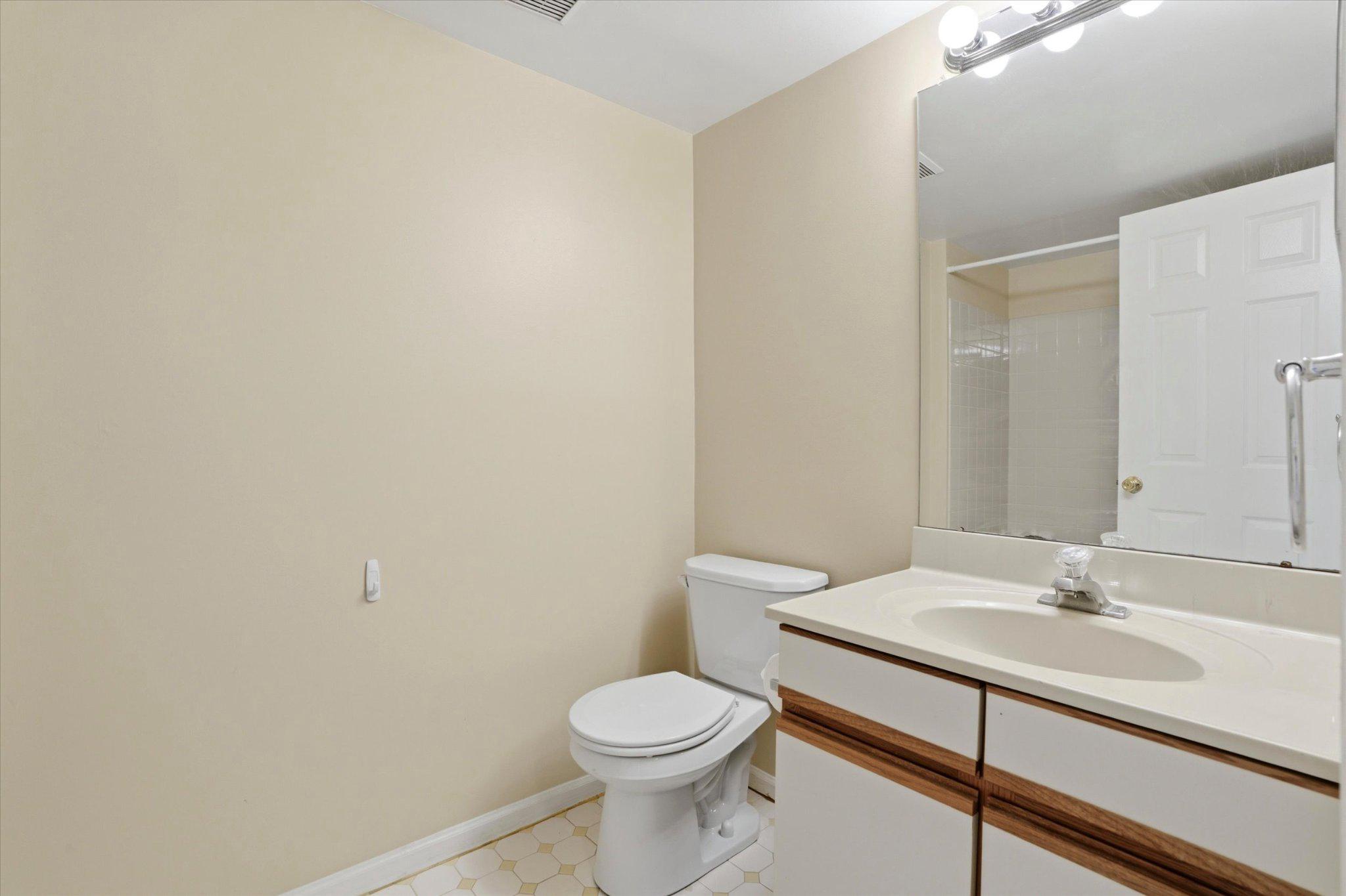 623 Washington Place Chesterbrook, PA 19087 - Photo 20 of 26 a bathroom with a sink a toilet and mirror