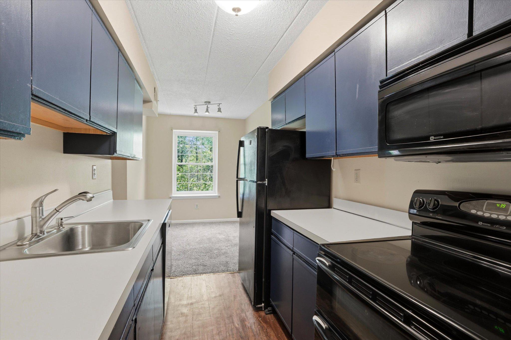 623 Washington Place Chesterbrook, PA 19087 - Photo 6 of 26 a kitchen with a sink stove and refrigerator