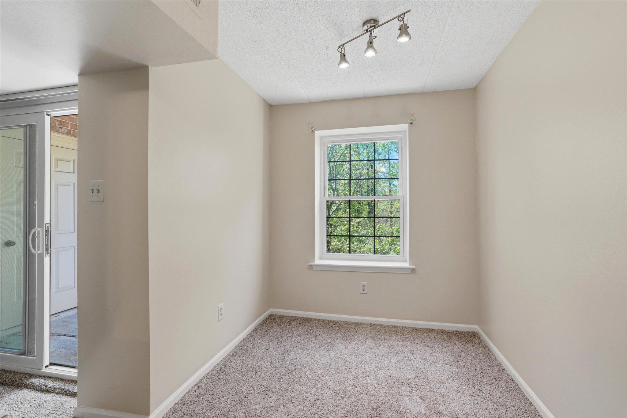 623 Washington Place Chesterbrook, PA 19087 - Photo 8 of 26 an empty room with a window and chandelier fan