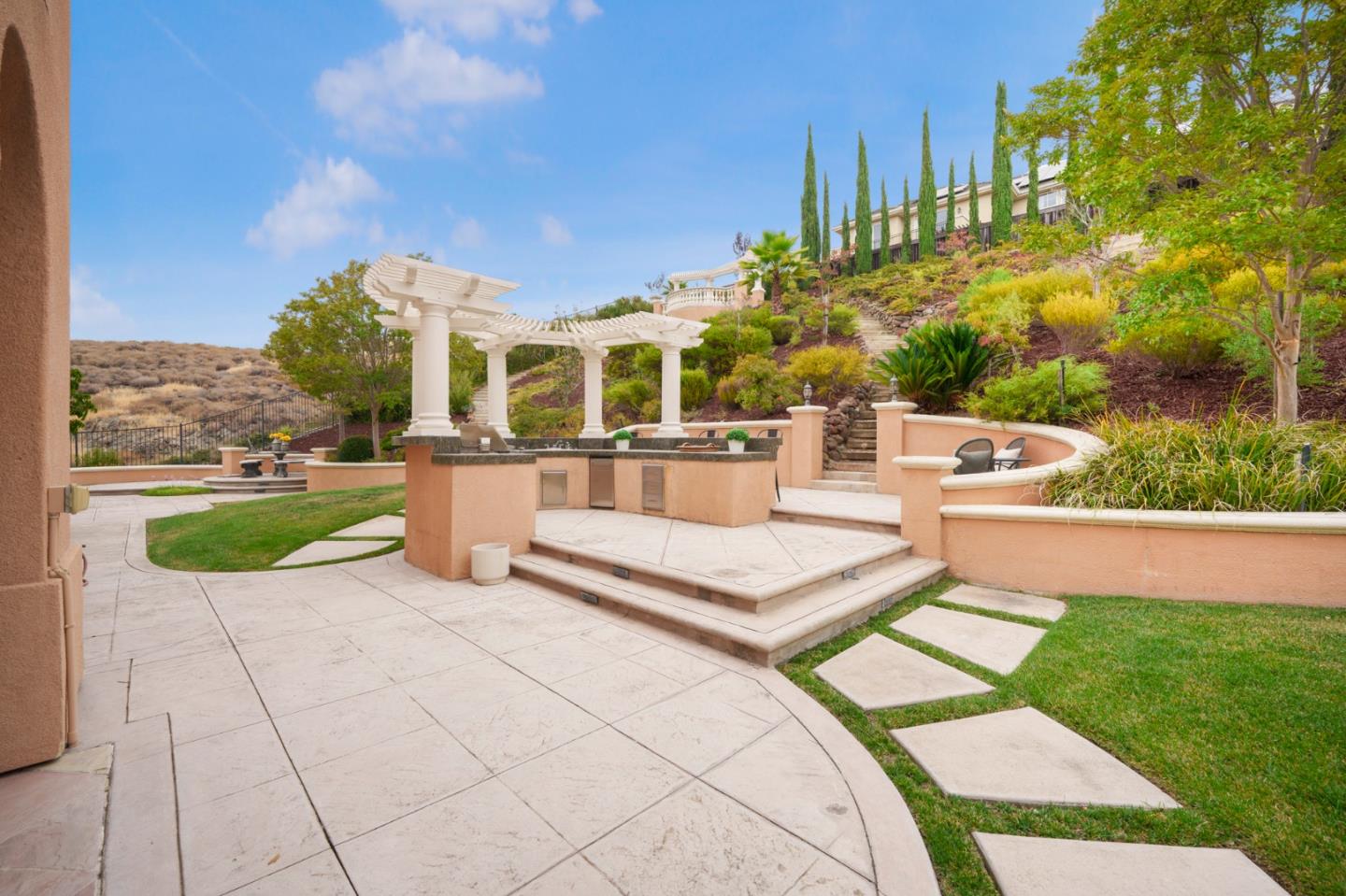 4800 Shady Meadows Place San Jose, CA 95138 - Photo 11 of 89 a view of a patio with couches and table and chairs with wooden fence