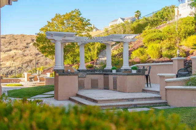 a large bathroom with a large tub sink vanity and window