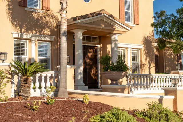 a bathroom with a sink vanity mirror and toilet
