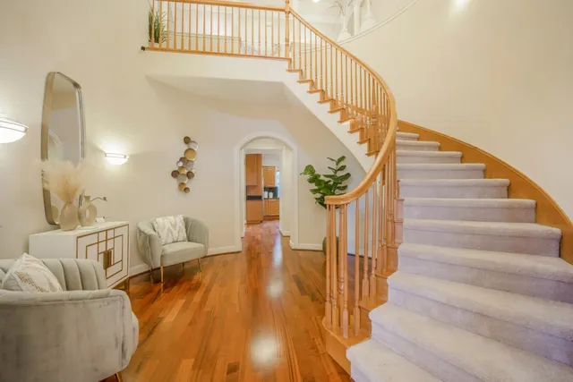 a bedroom with a bed and a painting on the wall