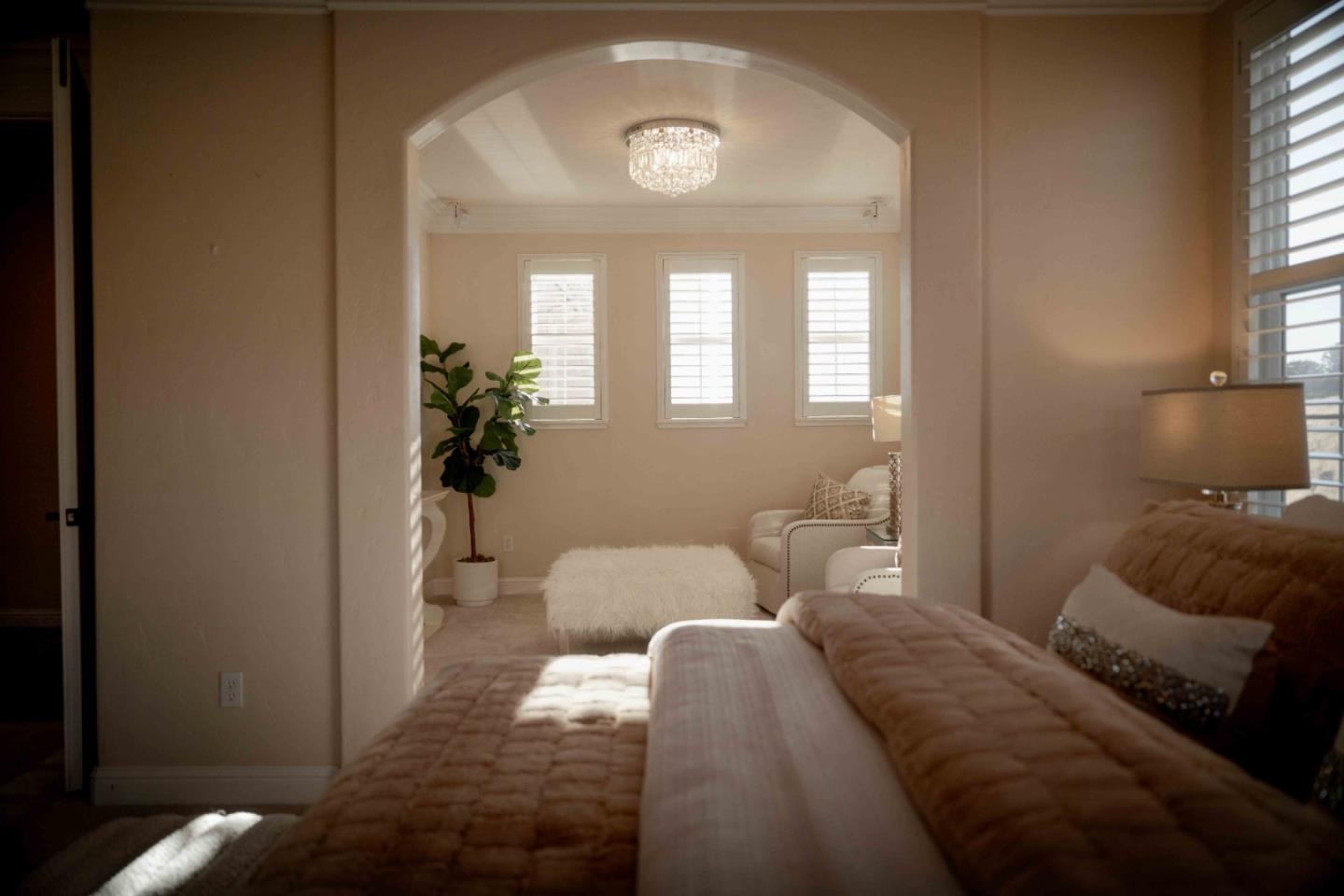 4800 Shady Meadows Place San Jose, CA 95138 - Photo 40 of 89 a bedroom with a bed and a potted plant