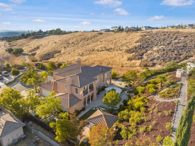 a view of a swimming pool with a yard