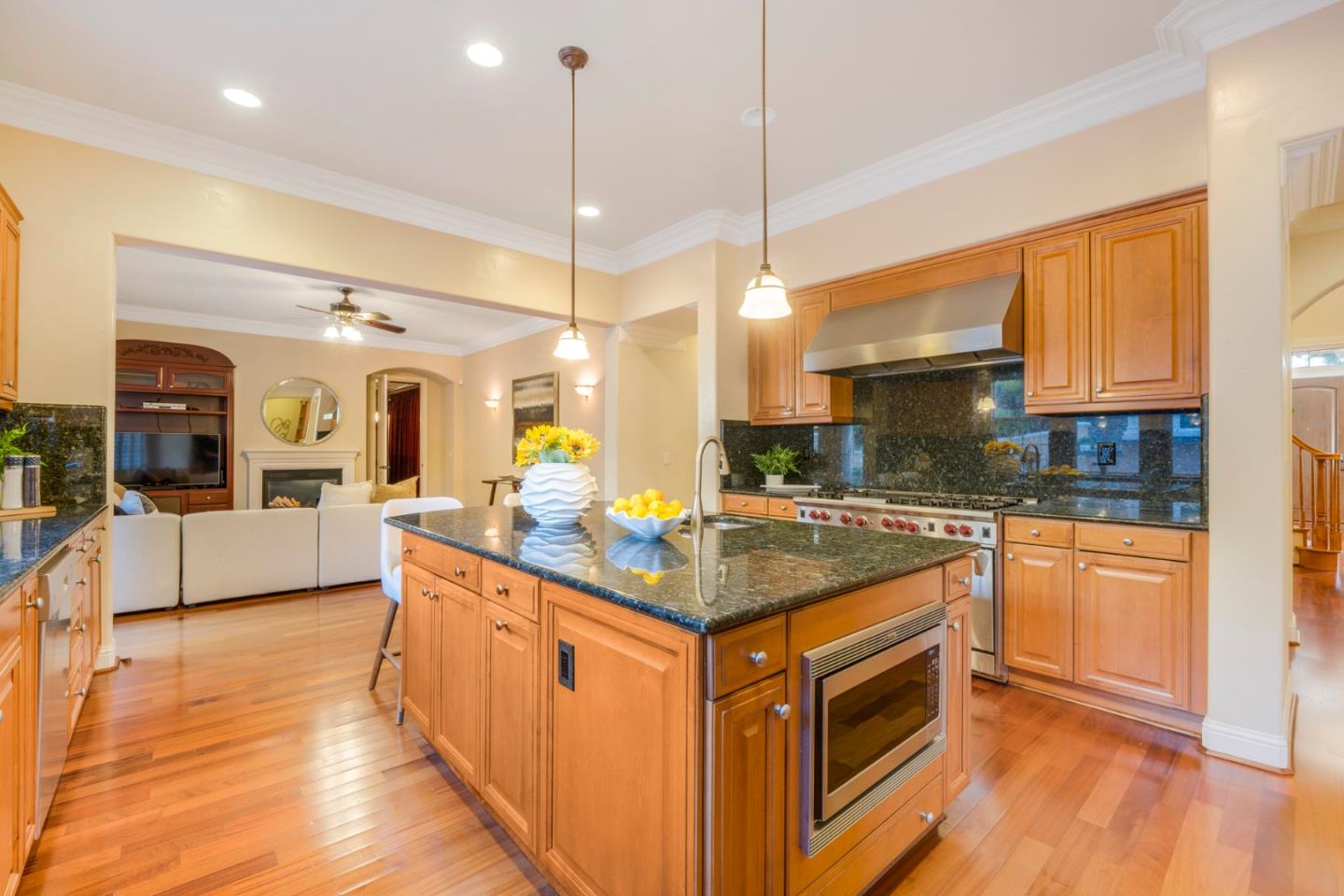 4800 Shady Meadows Place San Jose, CA 95138 - Photo 71 of 89 a kitchen with stainless steel appliances granite countertop a stove a sink and a wooden cabinets