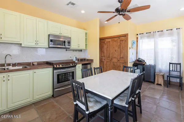 a view of a yard with snow on the road