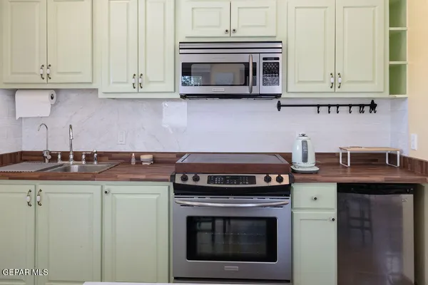 a view of a house with swimming pool and sitting area