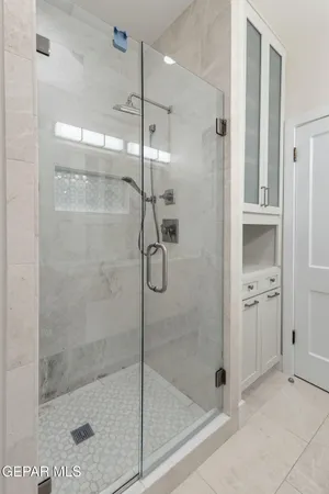 a view of a yard with plants and trees