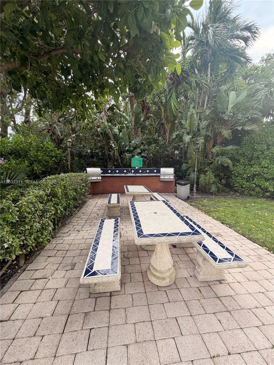 150 Southeast 25th Road, Unit 15J Miami, FL 33129 - Photo 18 of 20 BBQ - And seating area near the pool