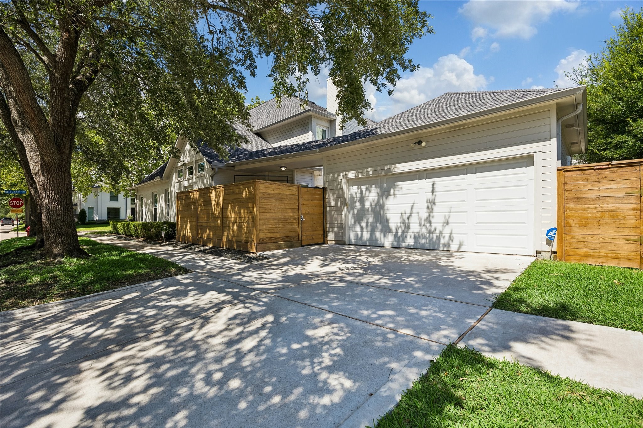 4131 Sunset Boulevard Houston, TX 77005 - Photo 33 of 38 a view of a house with a yard and garage
