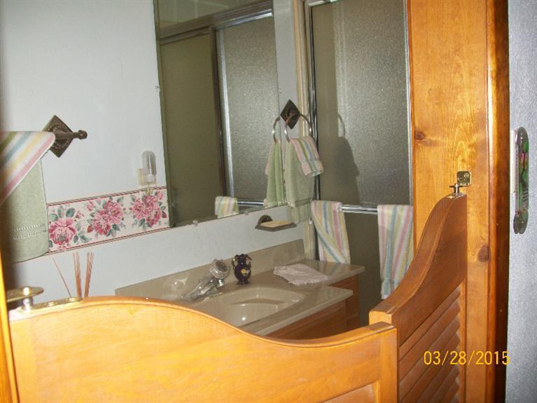 5015 Waldo Road Cave Junction, OR 97523 - Photo 18 of 35 a bathroom with a sink and a mirror