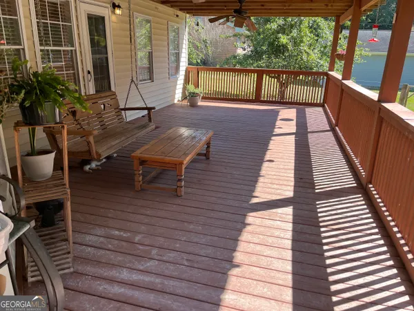 a balcony with wooden floor
