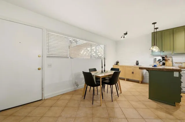 a view of a dining room with furniture and window