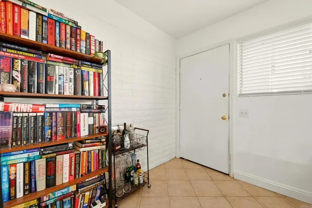 a view of an empty room with lots of furniture