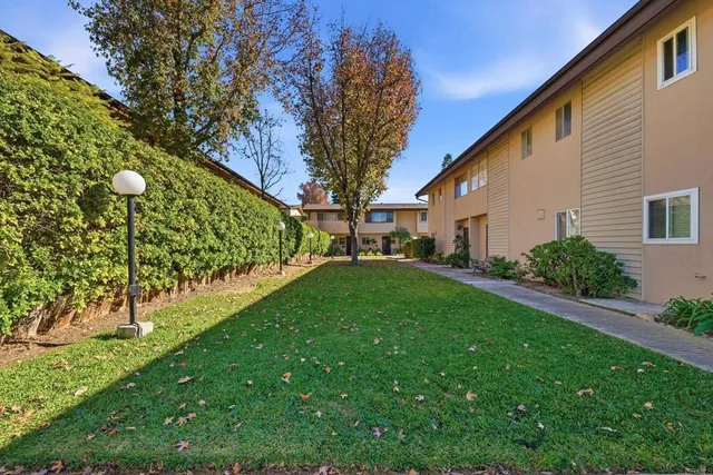 a swimming pool with outdoor seating and yard