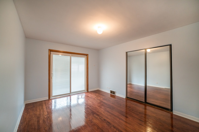 7609 Traube Street North Riverside, IL 60546 - Photo 12 of 25 a view of empty room with wooden floor