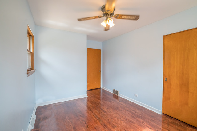 7609 Traube Street North Riverside, IL 60546 - Photo 15 of 25 a view of an empty room with wooden floor