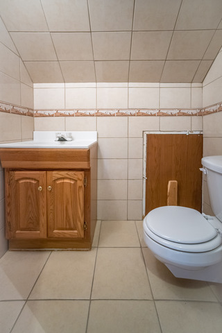 7609 Traube Street North Riverside, IL 60546 - Photo 21 of 25 a bathroom with a toilet and a sink
