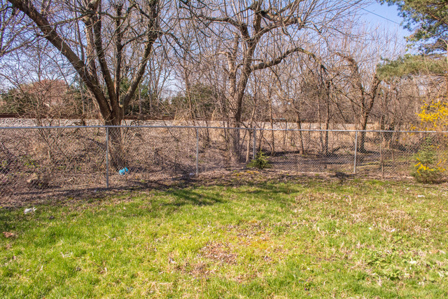 7609 Traube Street North Riverside, IL 60546 - Photo 24 of 25 a view of swimming pool with tree s