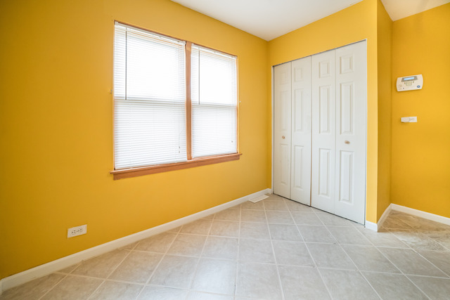 7609 Traube Street North Riverside, IL 60546 - Photo 8 of 25 an empty room with windows and closet