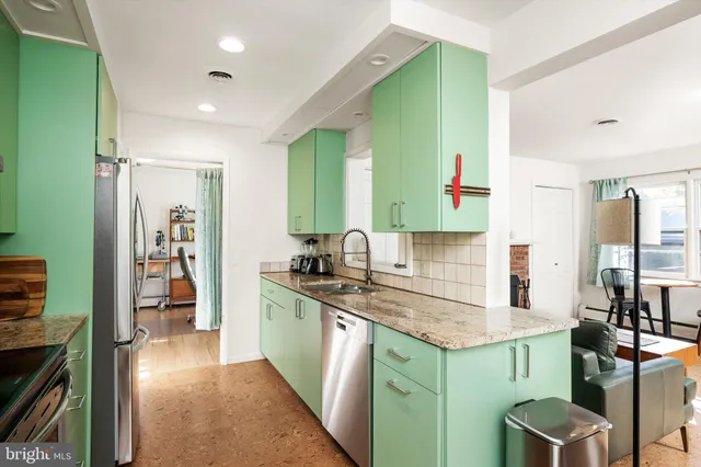 a kitchen with a sink cabinets and window