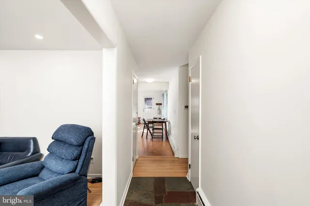 a hallway with furniture and a couch