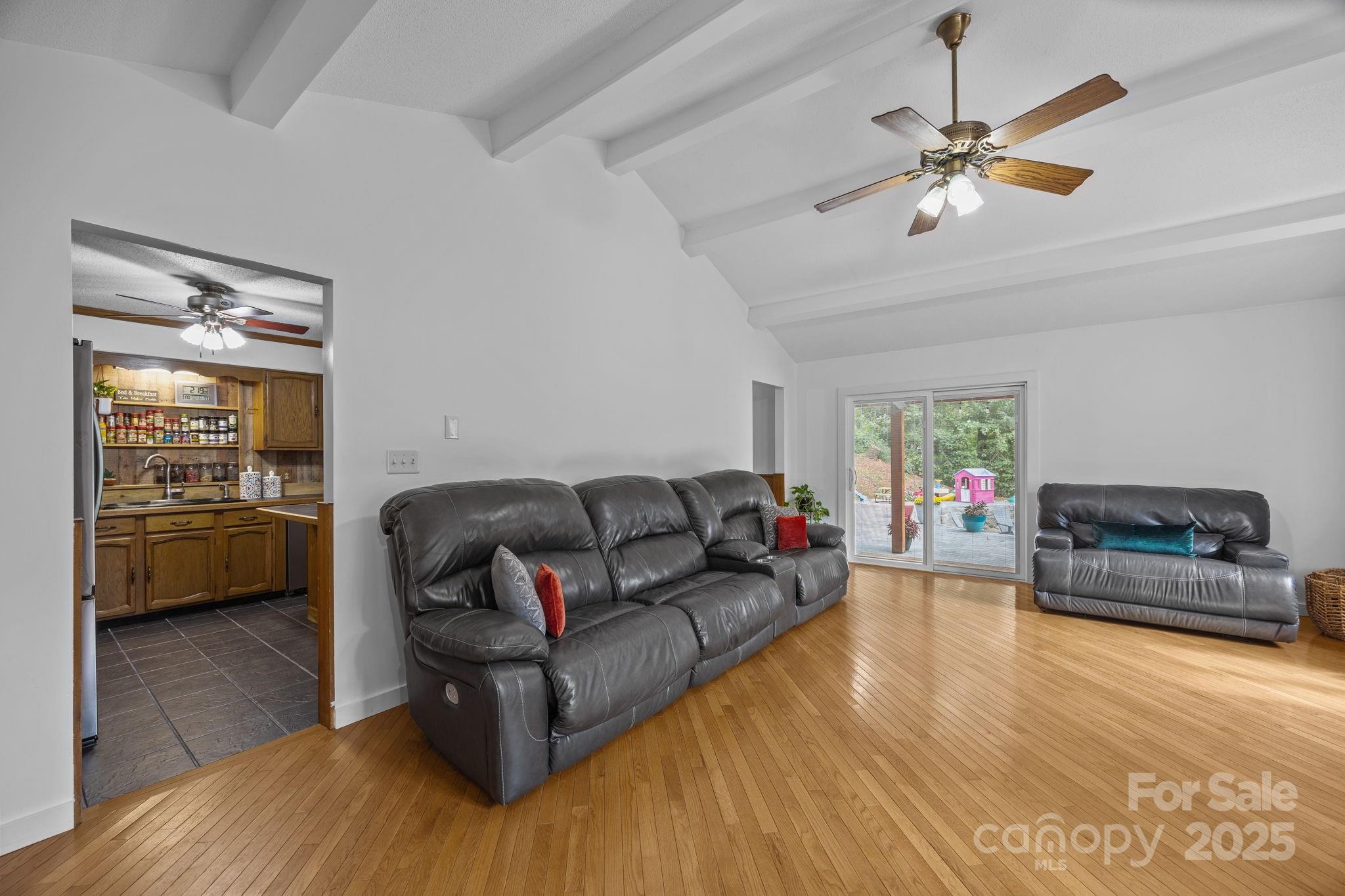 263 Morgan Branch Road Leicester, NC 28748 - Photo 16 of 31 a living room with furniture and a wooden floor