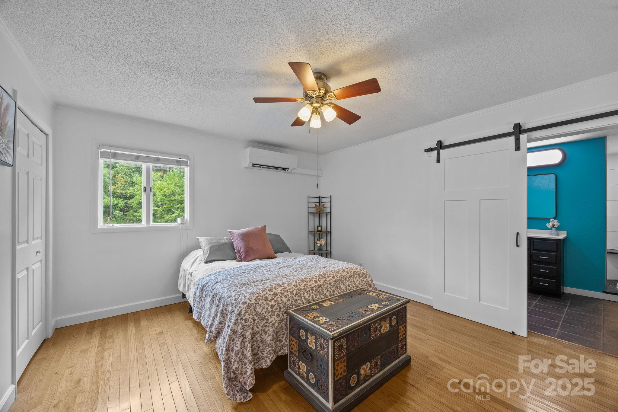 263 Morgan Branch Road Leicester, NC 28748 - Photo 22 of 31 a bedroom with a bed and a window