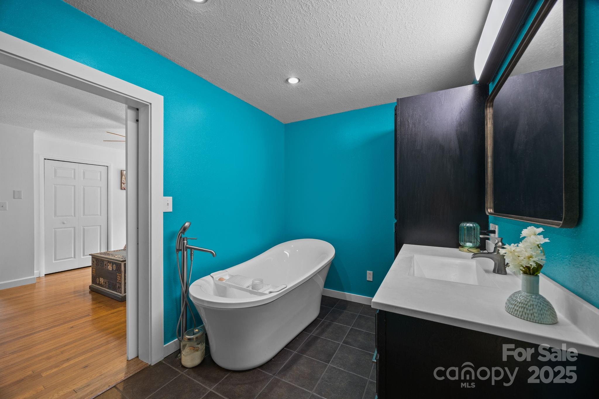 263 Morgan Branch Road Leicester, NC 28748 - Photo 25 of 31 a bathroom with a toilet sink and mirror